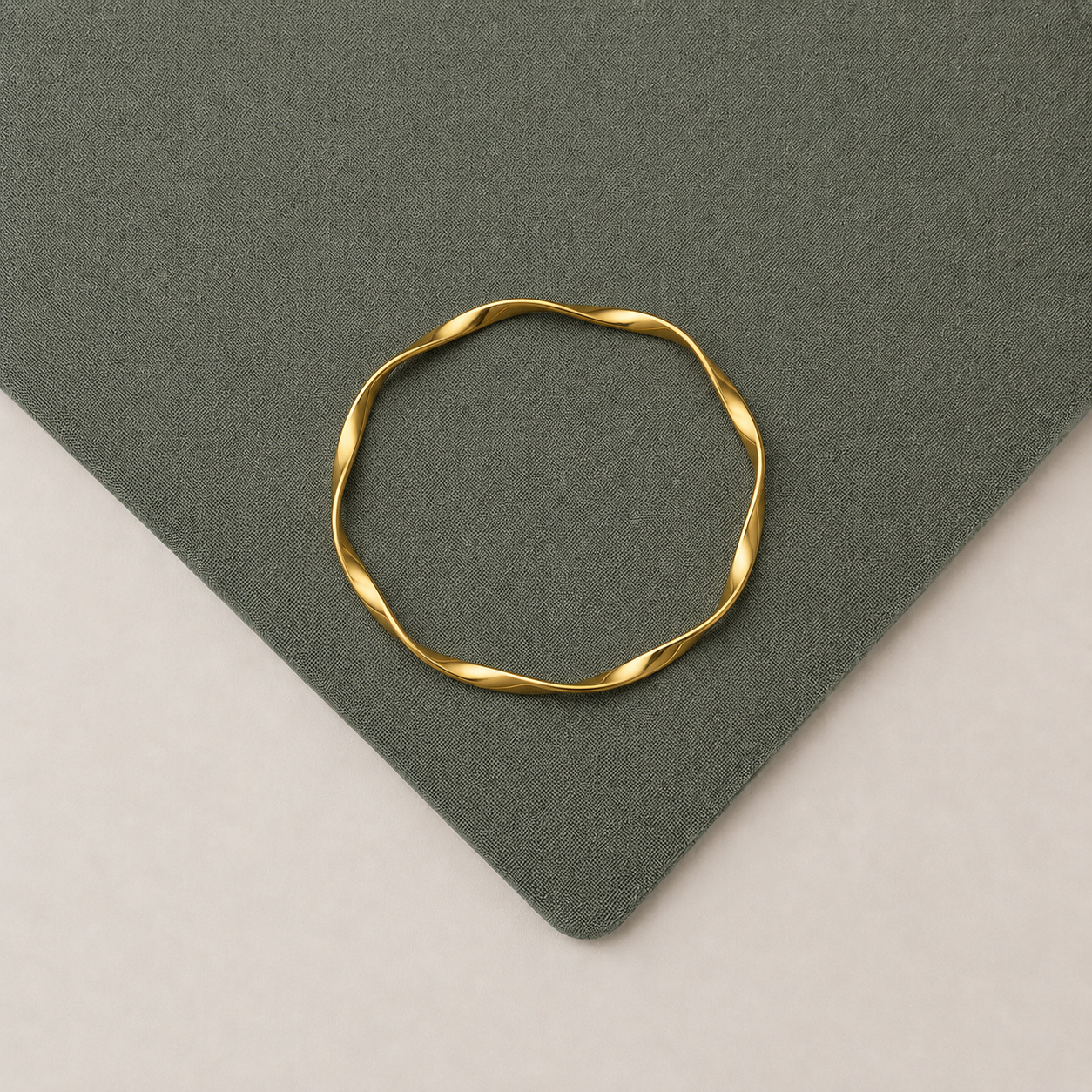 Minimal Twist Gold Bangle