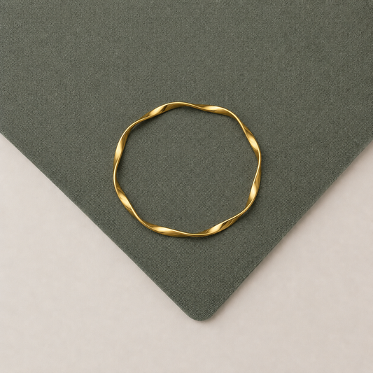 Minimal Twist Gold Bangle