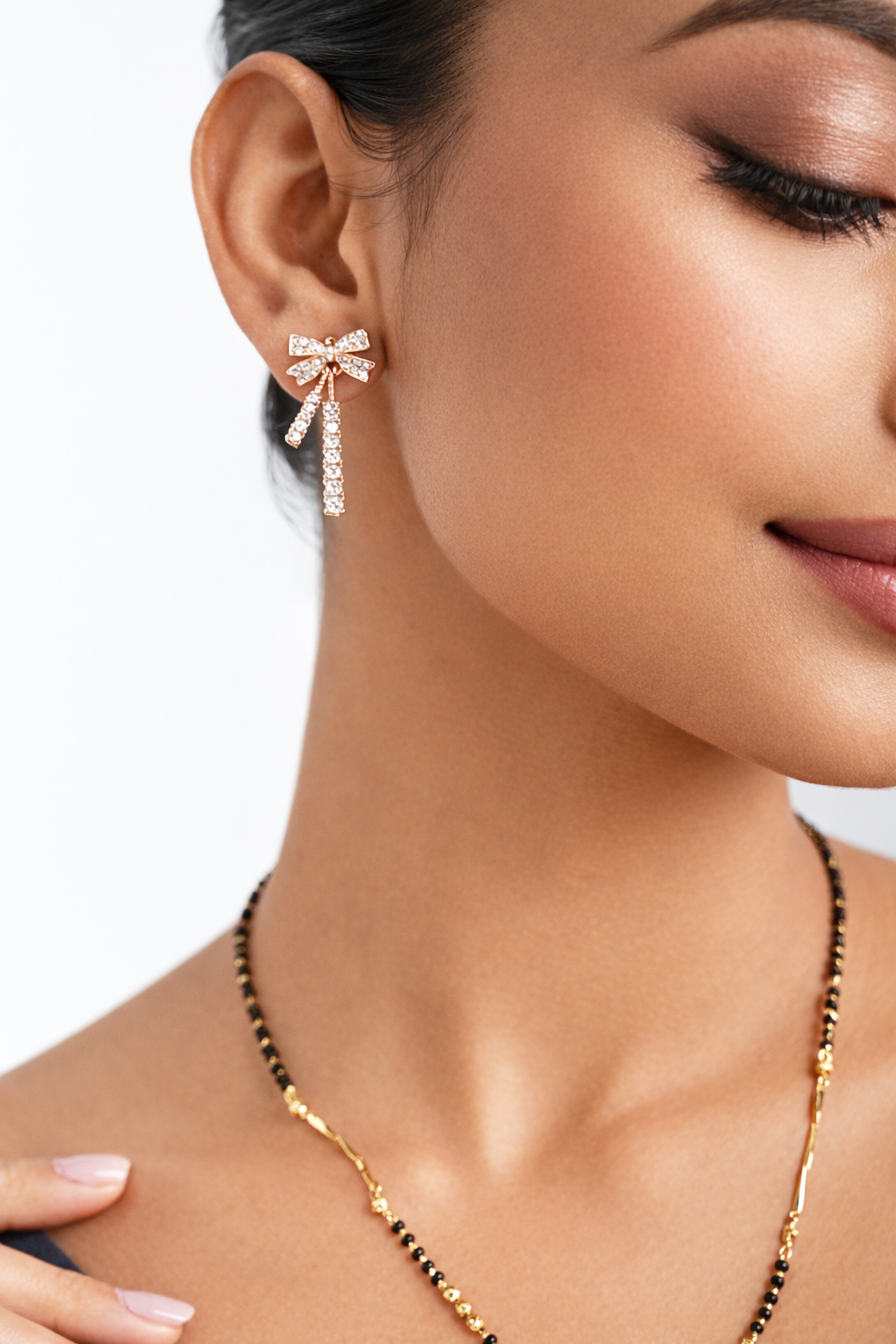 Rose gold bow Ad earring with cubic zirconia - Image 2